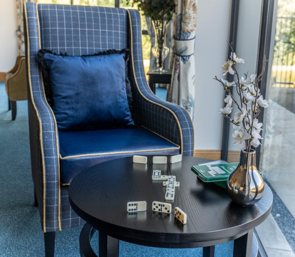 Armchair with Dominos on Table