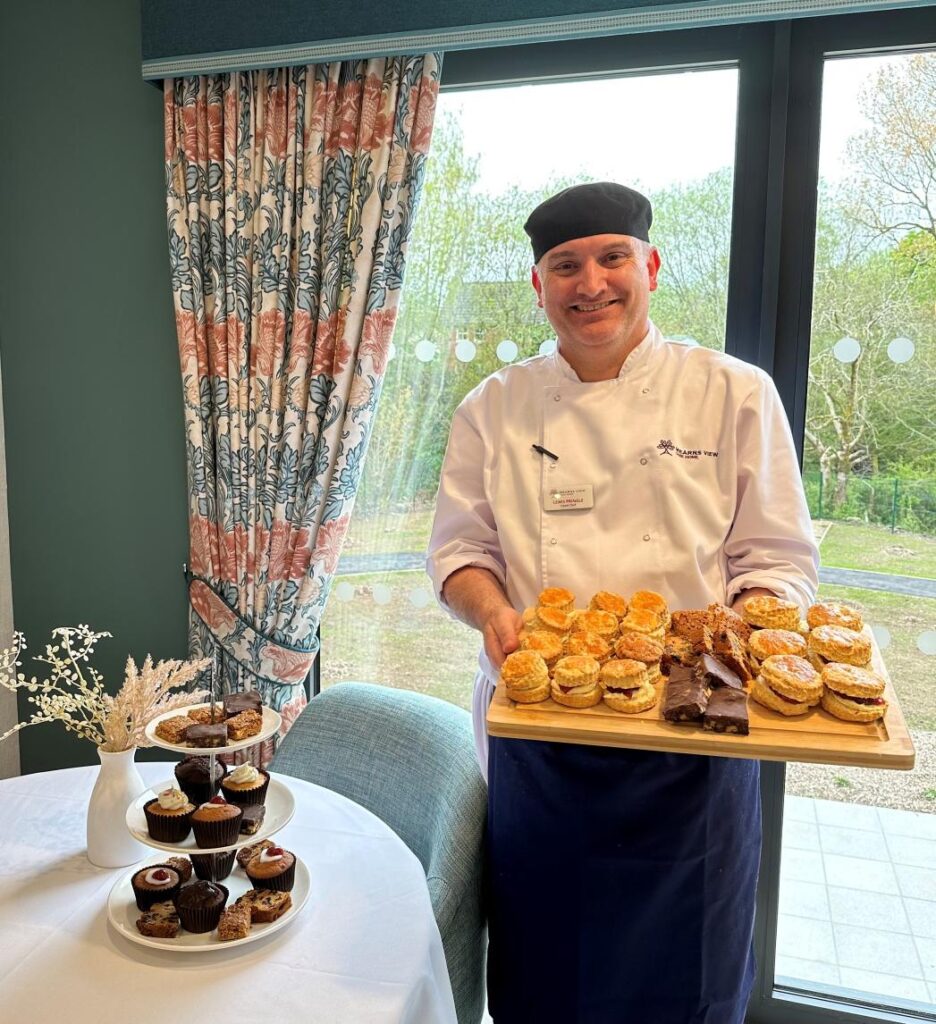 Chef Holding Baked Treats