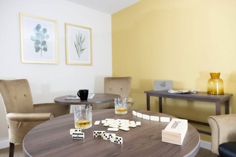 Communal Living Room with Dominos on Table