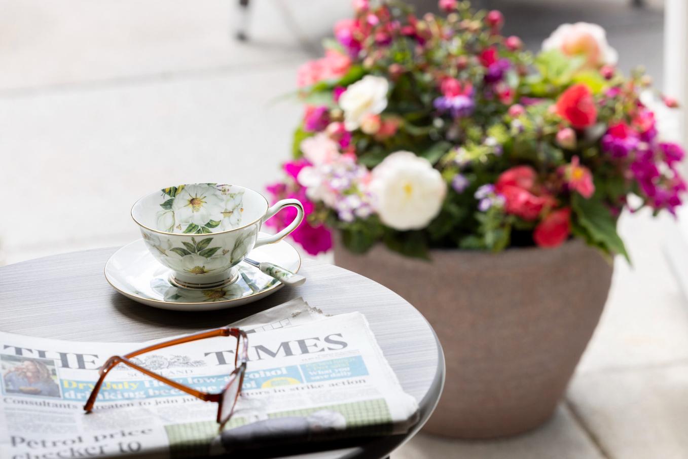 tea-outside-with-newspaper