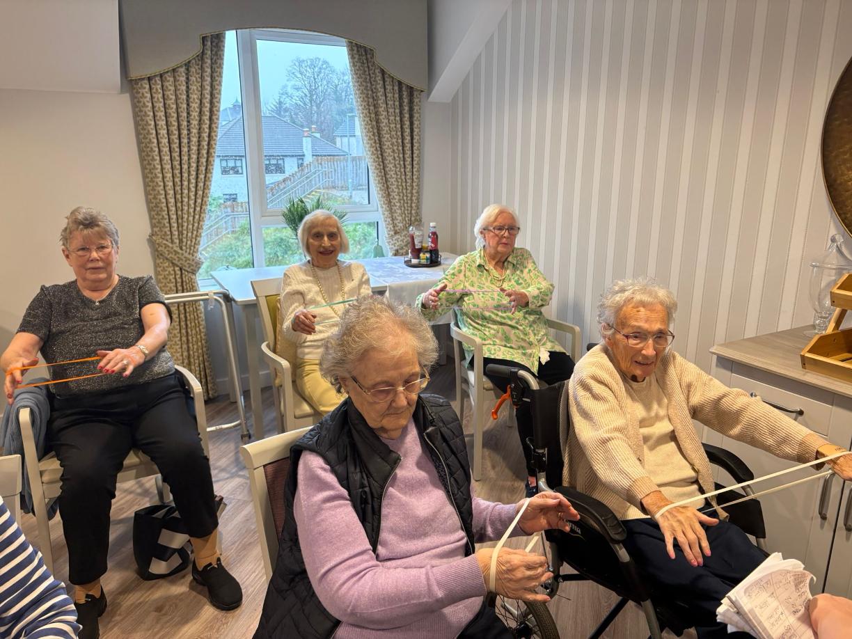Fitness class with resistance bands in a care home