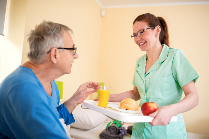resident in a care home receiving his lunch