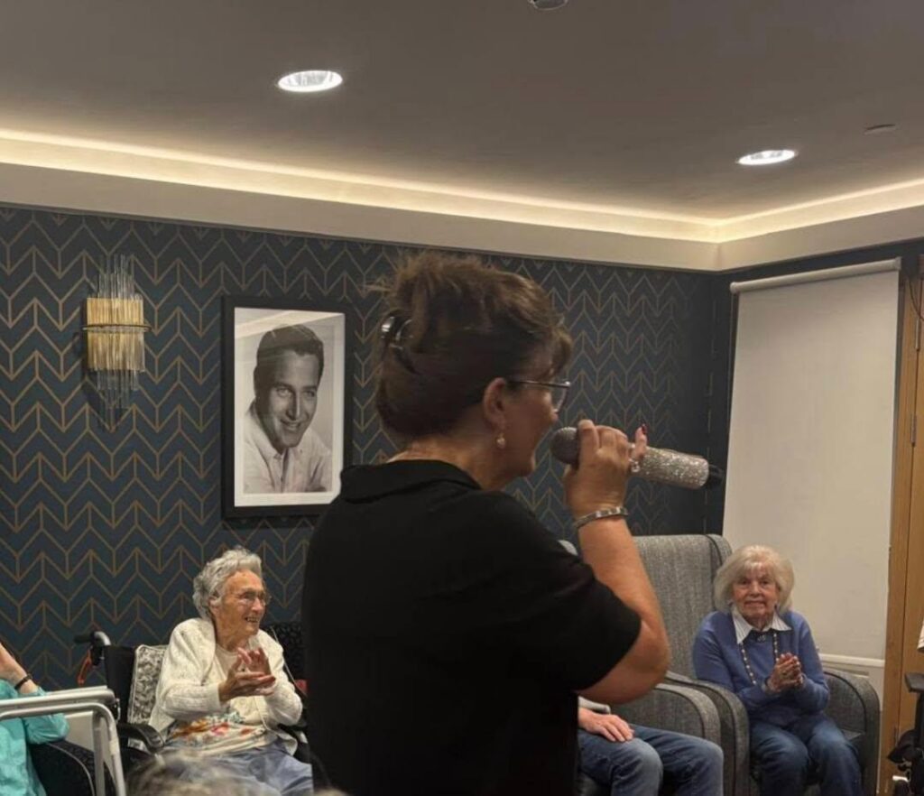 entertainer singing to residents