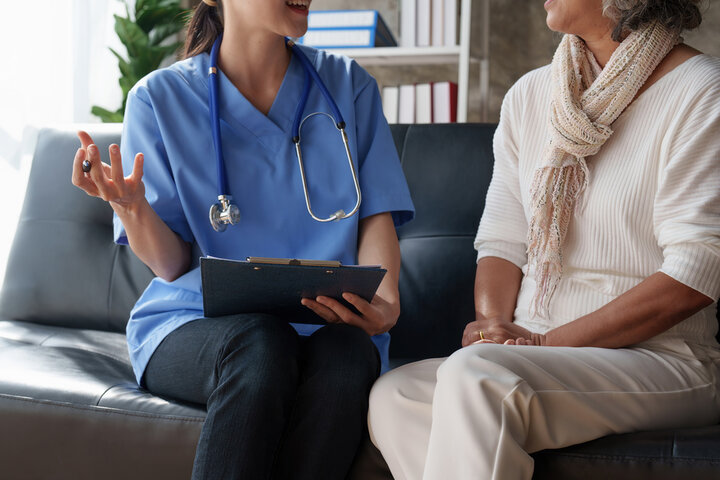 nurse and resident talking about fees